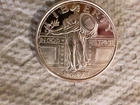 1 troy ounce Lady Liberty silver round.