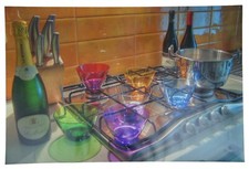 Colored Glass Bowls Bottles on Stove Photographic Print Champagne 30"