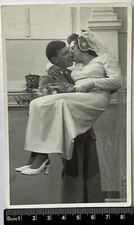 Cute couple kissing. Affectionate guy holds the bride in his arms Closeness