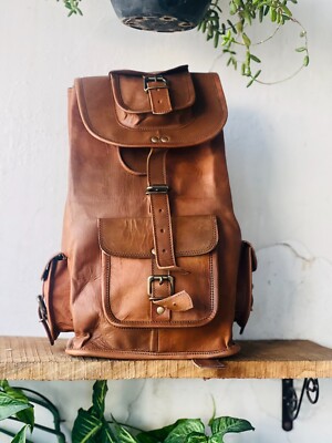 6 in 1 leather backpack Crossbody Bag 2 interior slip pockets for phone and accessories Brass hardware Exterior back zip pocket Exterior front zip pocket Lined interior Adjustable shoulder strap Padded laptop sleeve The Leather Duffle Backpack 6-in-1