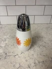 Vintage Gemco milk glass sugar dispenser with floral decals and chrome lid.