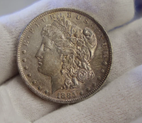 1885 O US Morgan Silver Dollar $1 AU (Toned)