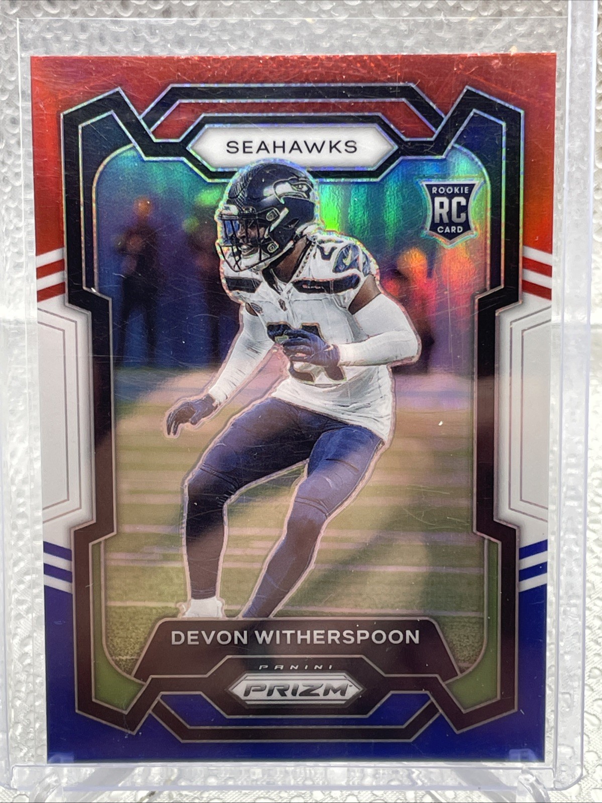 2023 Panini Prizm Football #389 Devon Witherspoon Red/White/Blue Prizm RC Rookie