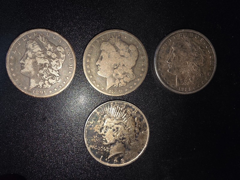 US (3) Morgan 1891, 1899-O, 1921-S, (1) Liberty 1923, (1) 2018 Silver Eagle COA