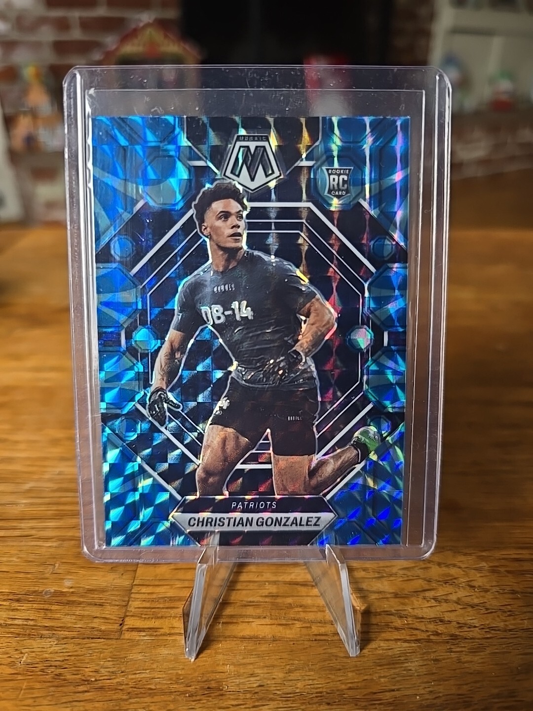 2023 PANINI MOSAIC CHRISTIAN GONZALEZ #300 BLUE REACTIVE PRIZM ROOKIE PATRIOTS