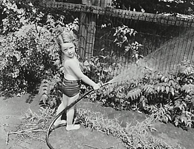 Black and White Photo Watering the Flowers in the Yard  Reprint A-11