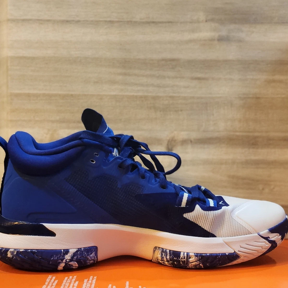 Royal blue and top white basketball shoes
