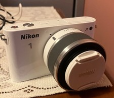 nikon camera with lens and bag