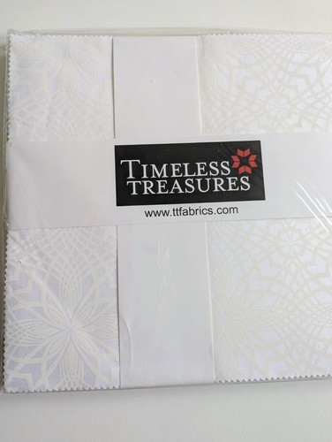 Timeless Treasures layer cake, white on white patterns.