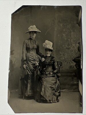 Tintype photo of two ladies dressed for the cold, late 1800s Tintype photo of two ladies dressed for the cold, late 1800s