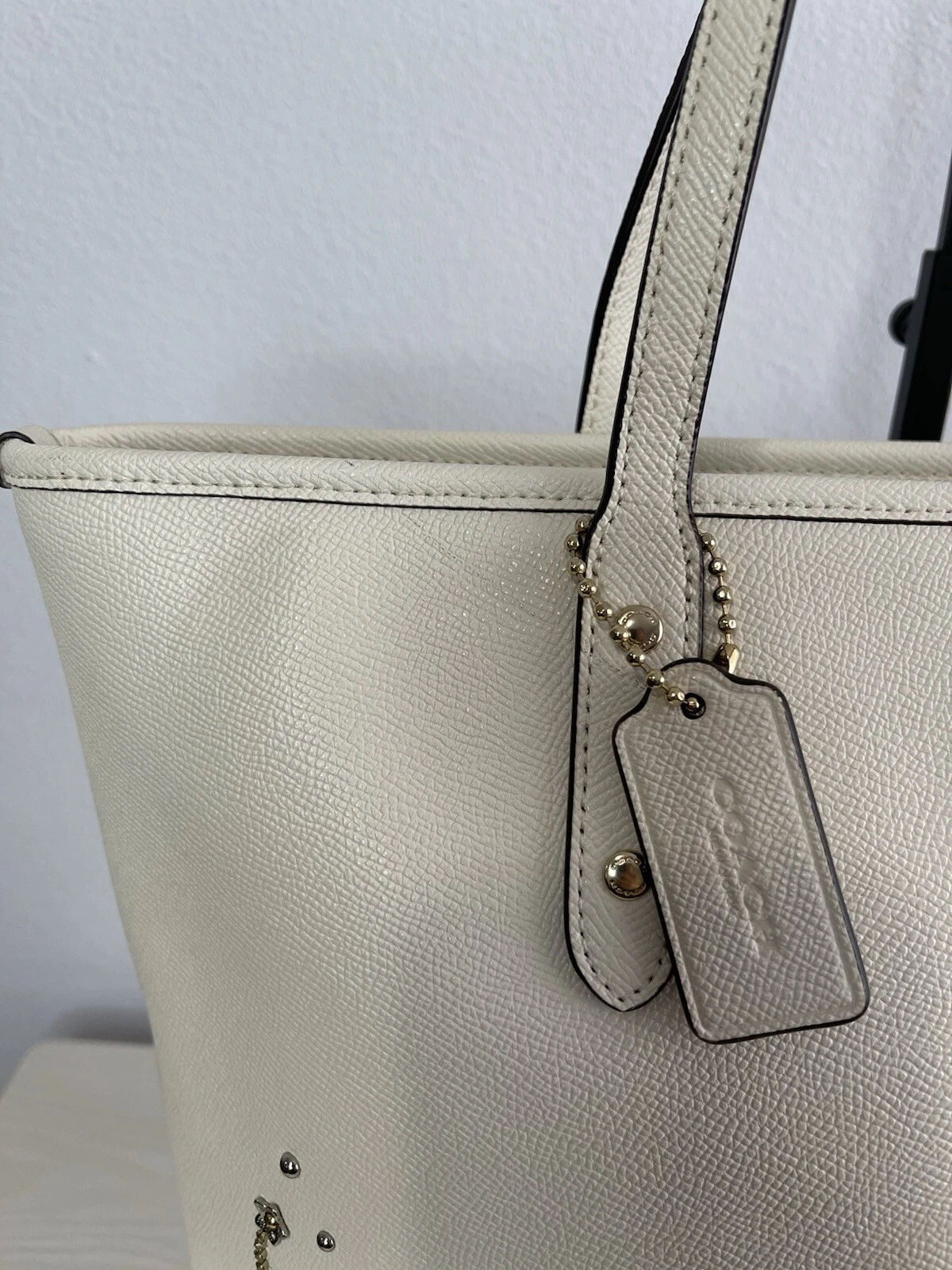 Borsa Coach City con zip e rivetti in cristallo polvere di stelle