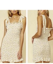 Free People Bella Smocked Floral Mini Dress in size M.