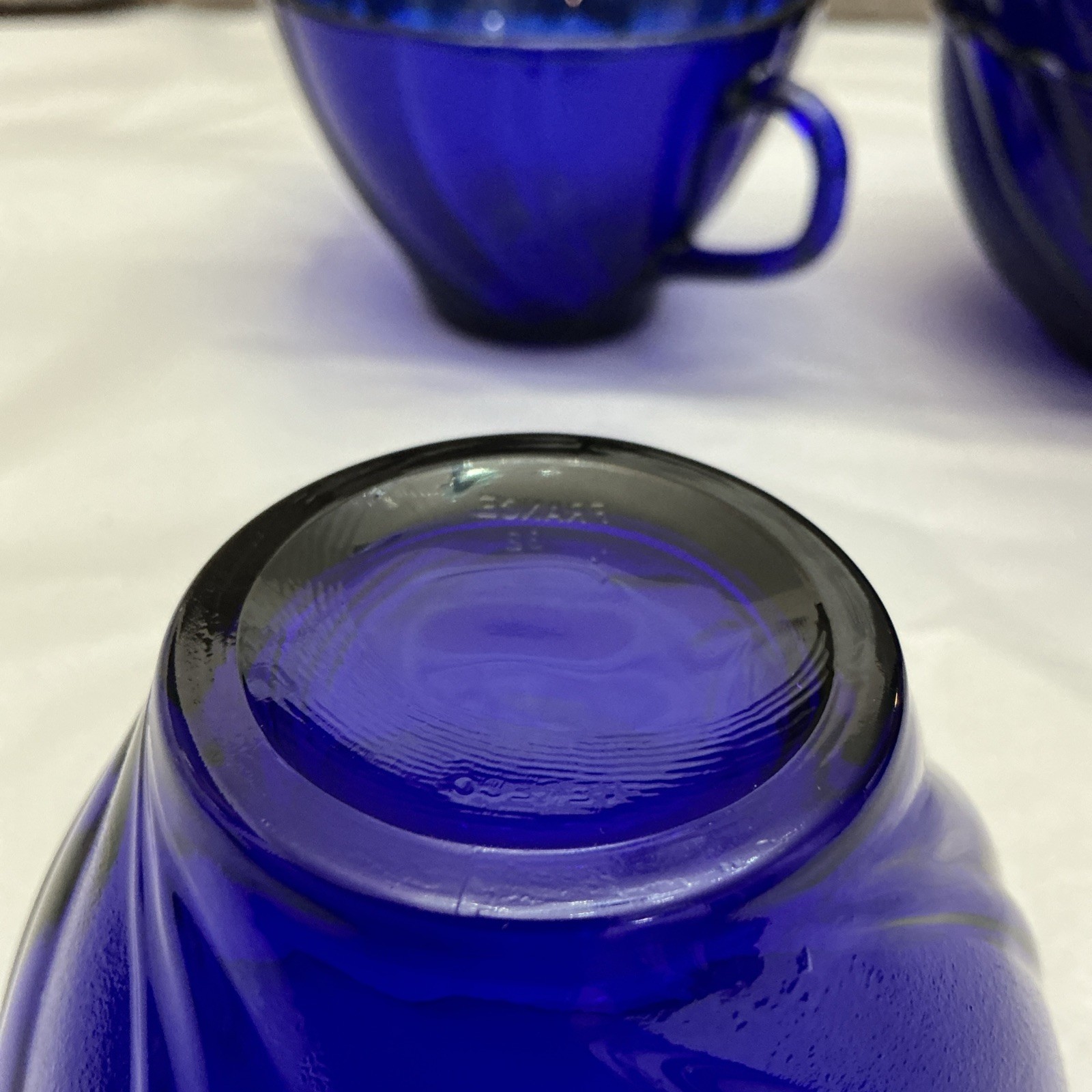 Four Pieces Of Cobalt Blue France Produced Serve Ware. 2 Berry Bowls And 2 Cups