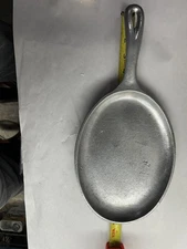 Service Ideas, Inc. SK-107CA is a sand-cast aluminum, oval-shaped fajita skillet
