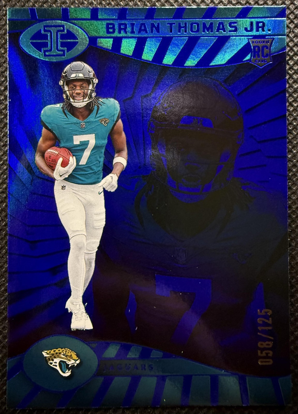2024 Panini Illusions #41 Brian Thomas Jr. Blue Trophy Collection Rookie #/125