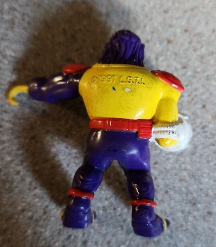 Mini figura vintage 1991 bolsa de basura racimo ojo salvaje juguete púrpura un ojo años 90 - Imagen 2 de 2