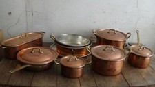 Batteria di pentole in rame martellato a mano e stagnato con manici in ottone