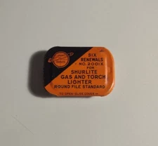 Vintage Shurlite Gas and Torch Lighter Six Renewals Metal Advertising Tin Used