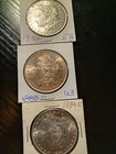 3 Morgan silver dollars. AU+ and BU. 1900-O,1883-O,1884-O.  No reserve.