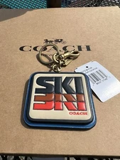 COACH C7073 MULTI COLOR SMOOTH LEATHER SKI PATCH BAG CHARM BRASS/IVORY/ORANGE