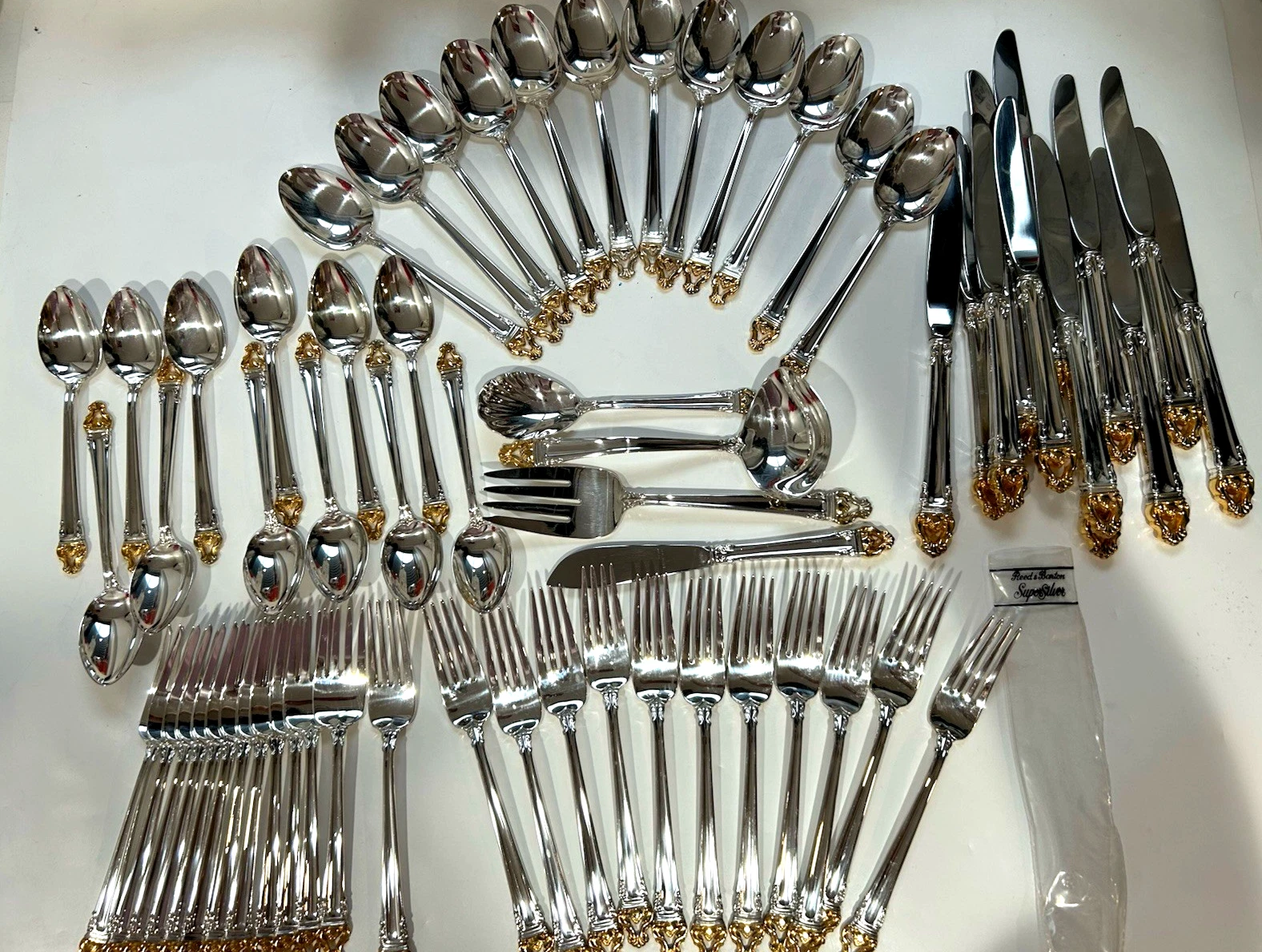 Reed and barton 64 Picas silverware with golden trim top