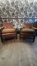 Pair Edwardian English Carved Oak Studded Leather Chairs With Lion Finials