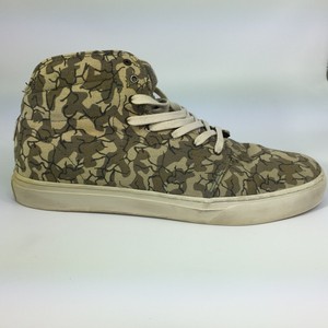 green and black high top vans