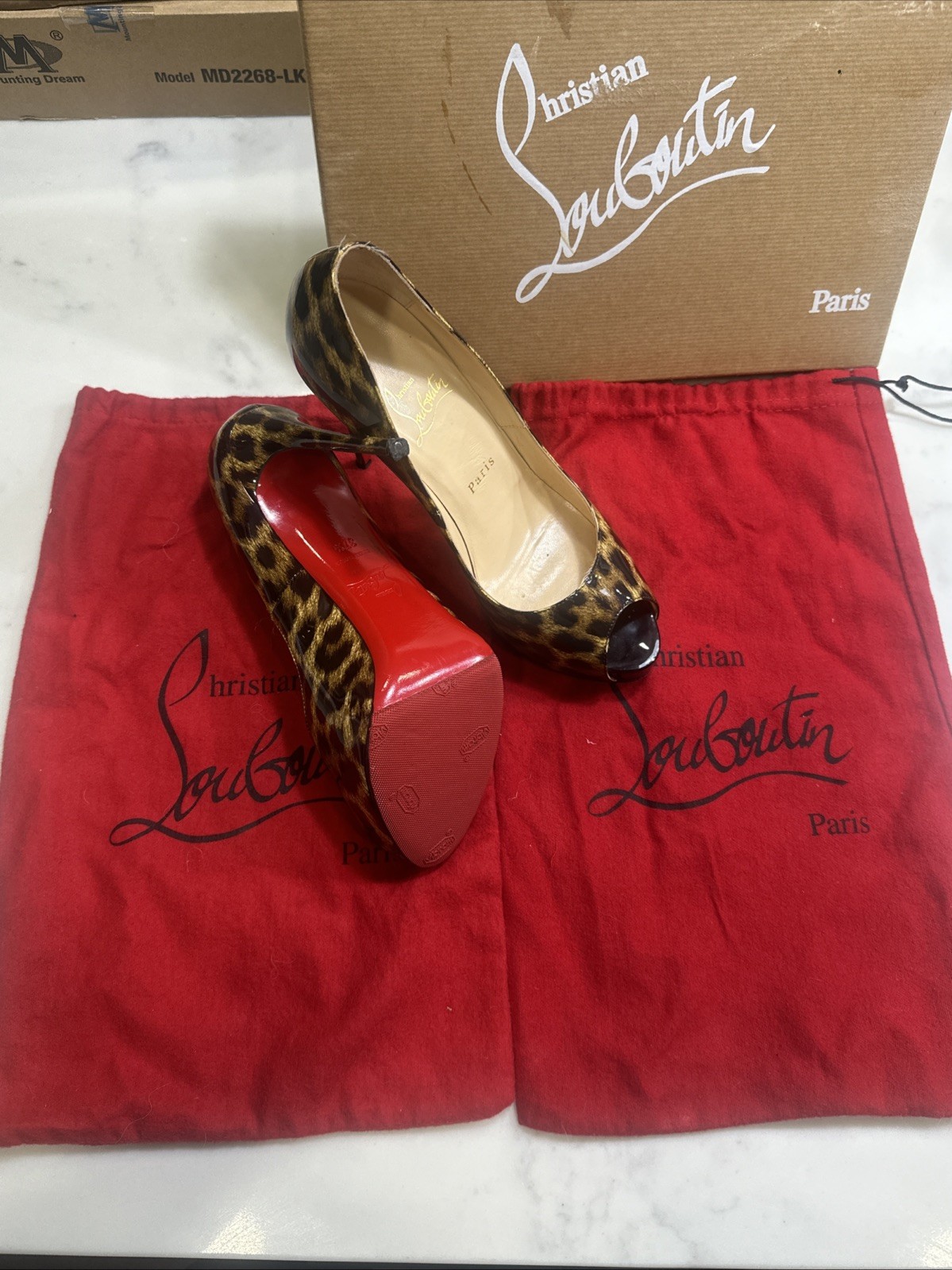Christian Louboutin Leopard Red Bottom heels protective sole professionally done