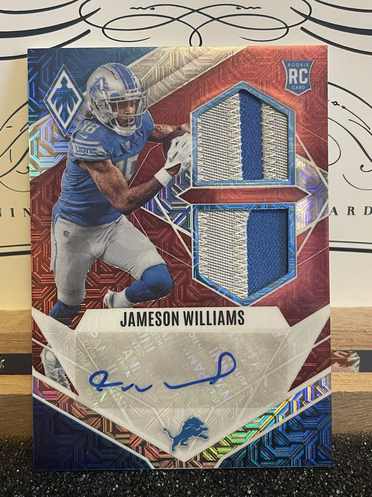 2022 Phoenix RPS Dual Jersey Prime Red Mojo Jameson Williams /10 Detroit Lions
