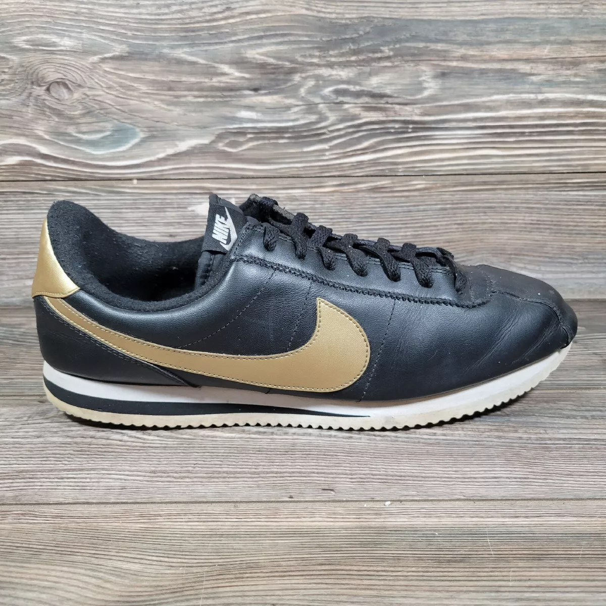 Gold and hotsell black nike cortez
