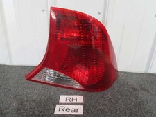 2002-04 Ford Focus Passenger Right Side Tail Light - Red Backing 3 Bulbs 2002-04 Ford Focus Passenger Right Side Tail Light - Red Backing 3 Bulbs