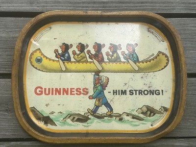 EARLY GUINNESS-HIM STRONG INDIAN CARRYING CANOE OVER ROCKY WATER METAL BEER TRAY