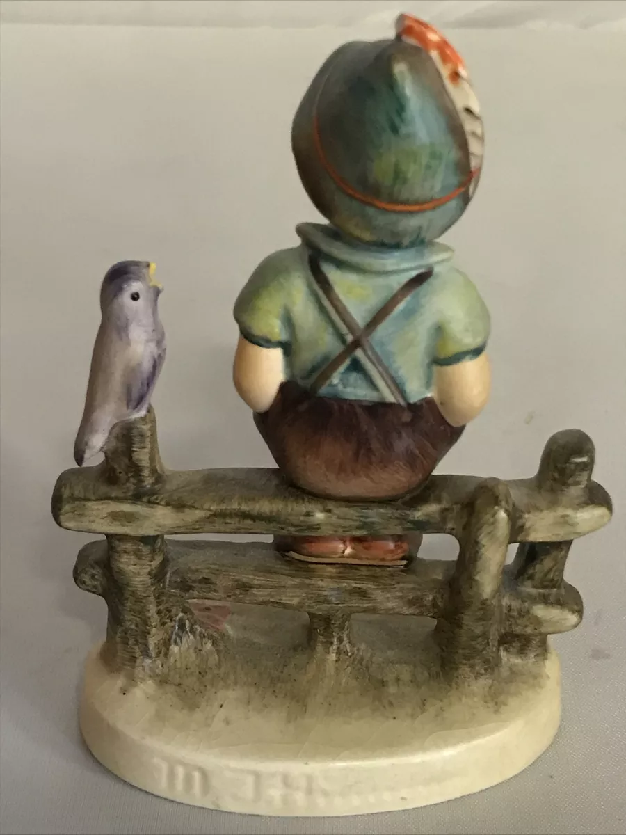 Hummel boy on fence with bird deals