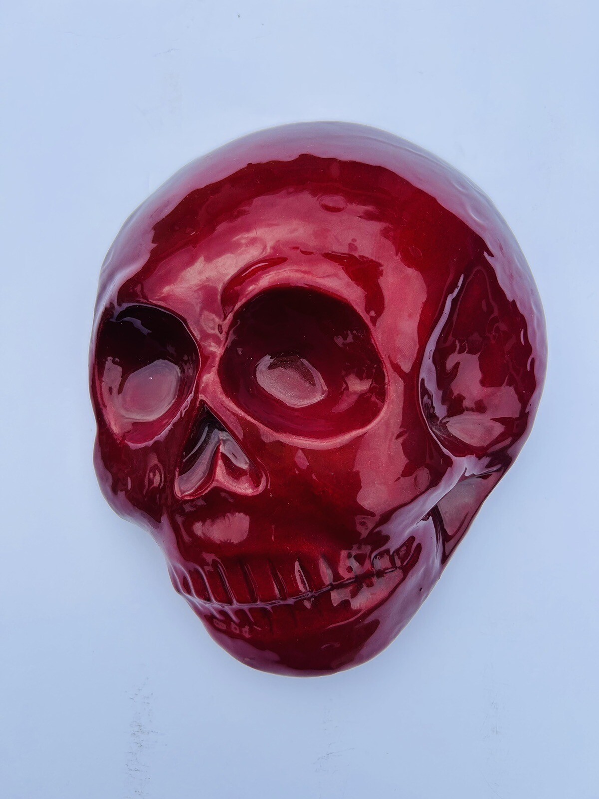 Handcrafted Ruby Red Glazed Skull Art by Serious Gnome – 9” Tall Canadian Ceramic Sculpture