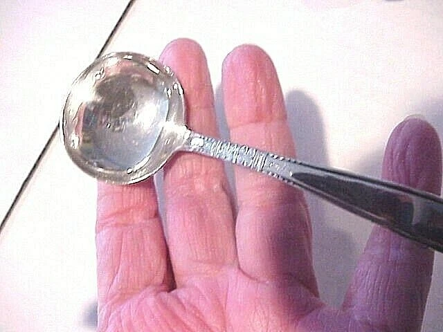 Sterling silver curved sauce spoon