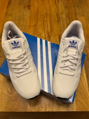 Baskets tissées Adidas Originals ZX 750 FTWWHT/GREONE/CRYAL UK 10 neuves emballées - Photo 1/4