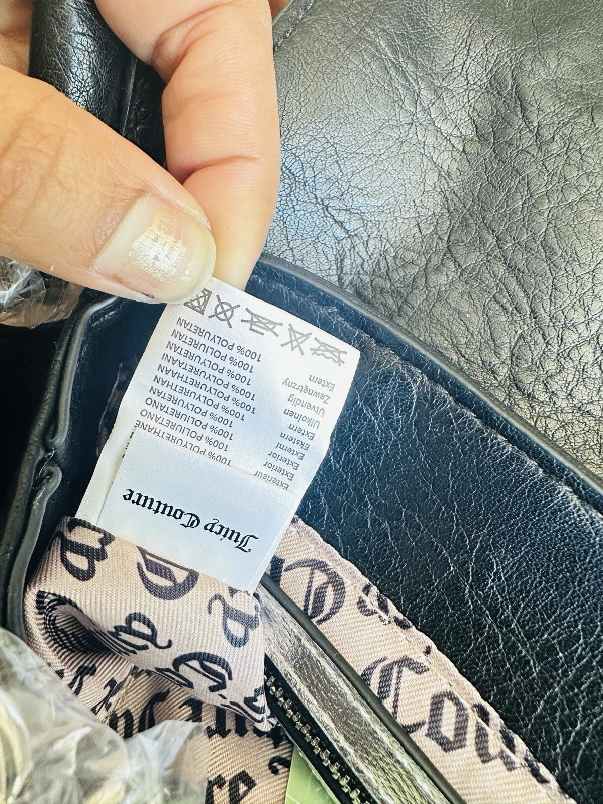 Borsa Juicy Couture nera con patta di loto con mini borsa abbinata