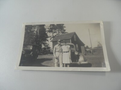 E2-18 Estate photo Boy with girlfriend on farm with cars in background 1940's