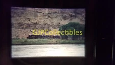 21211 35MM Train Slide ENGINES CARS STATIONS RIO GRANDE ROCK CLIFF BEHIND