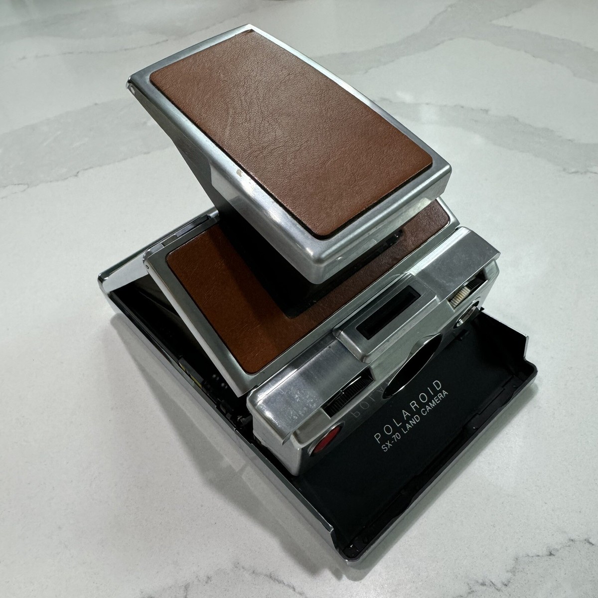 Appareil Photo Polaroid SX-70 Alpha 1 – Cuir Marron, état Occasion