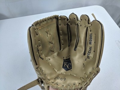 white and gold baseball glove