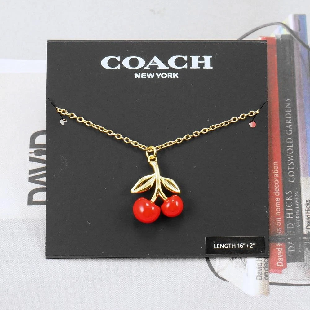 Collana Coach ciliegia rossa placcata oro nuova senza etichetta