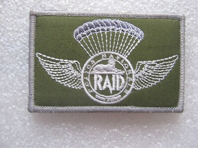 ECUSSON P.N LE RAID OPEX SCRATCH AU DOS 90MM X 55MM ETAT EXCELLENT