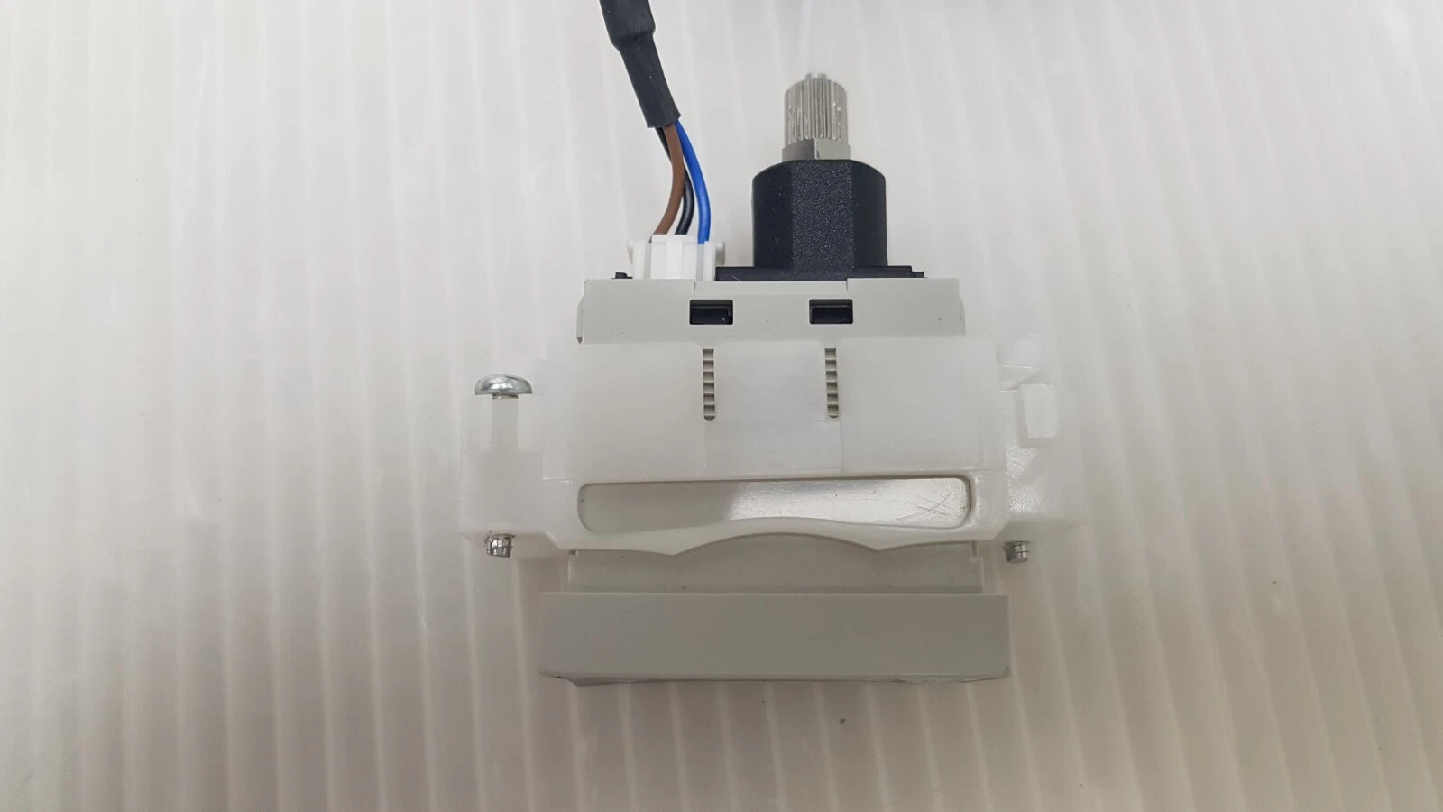 Top of the DP4-52Z showing the wired connector and the pressure port fitting