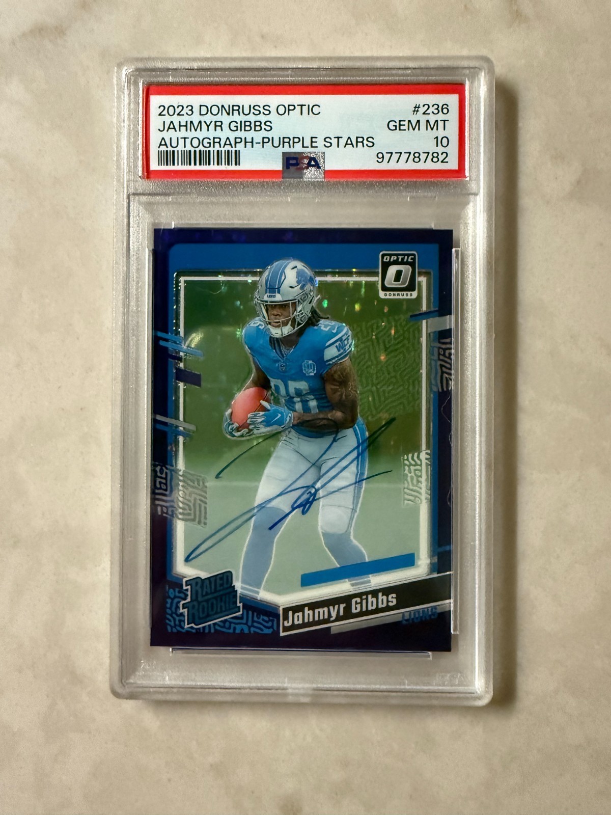 2023 Panini Donruss Optic - Jahmyr Gibbs #236 Auto Purple Stars /50 PSA 10