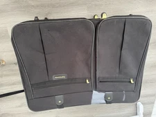 Large Black Samsonite Suitcase with wheels on it