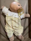 Vtg 1984 Cabbage Patch Kid Girl with yellow hair and cloth, Brown Eyes & A Binky