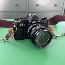 Black Canon AE-1 35mm SLR Film Camera with 50 mm 1.4 SSC