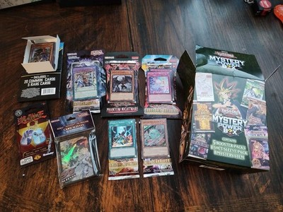 Konami Yu-Gi-Oh! TCG Mystery Power Box- 5 Boosters, 25 Pk, 50 Sleeves, Dog Tag