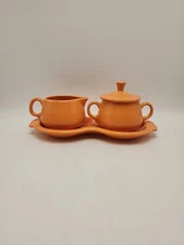 Homer Laughlin "Fiesta Tangerine" 10 Inch Cream & Sugar Set